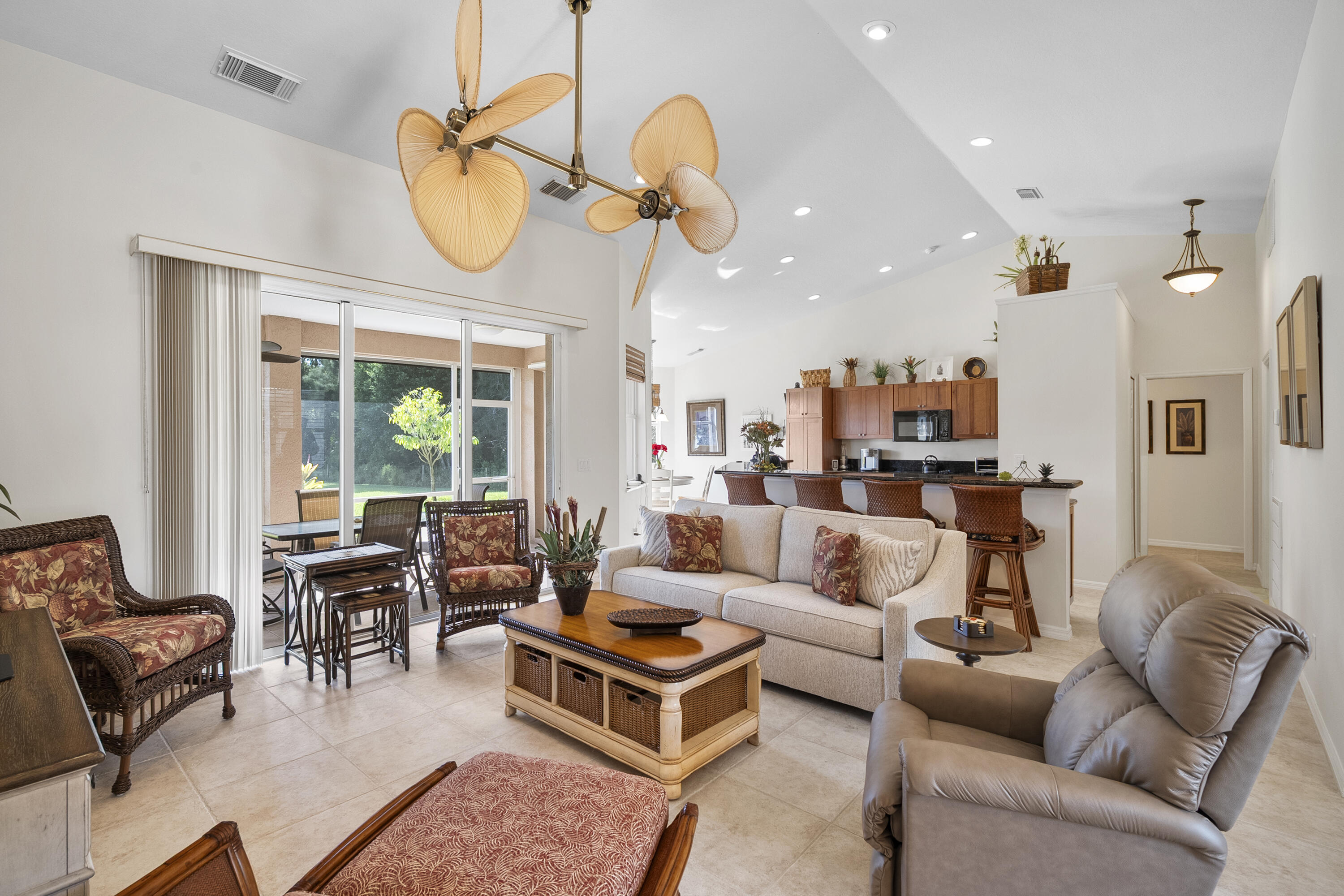 1234 Southwest Locks Road Stuart, FL 34997 - Photo 19 of 53 a living room with furniture a large window and a chandelier