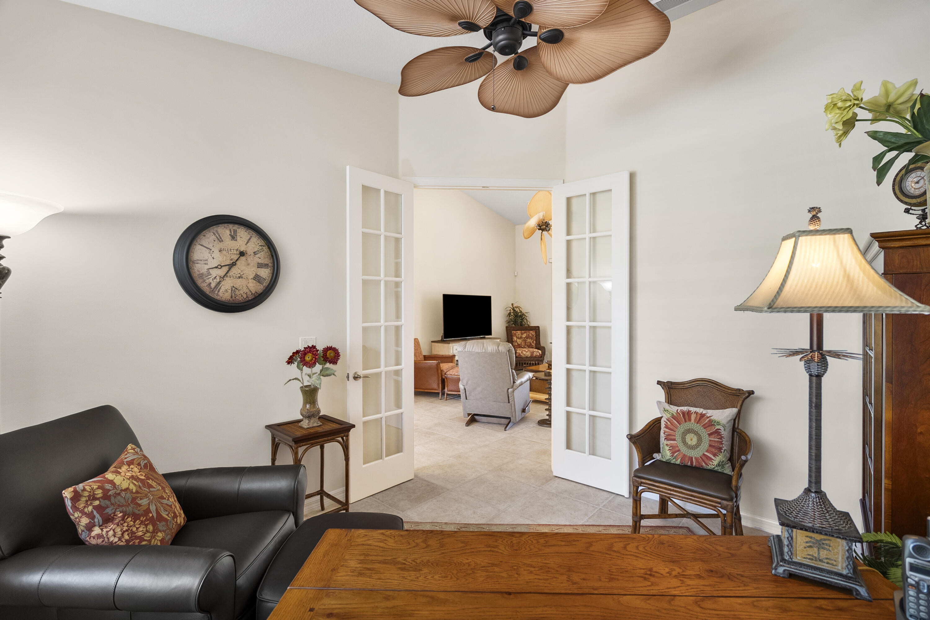 1234 Southwest Locks Road Stuart, FL 34997 - Photo 21 of 53 a living room with furniture and a mirror