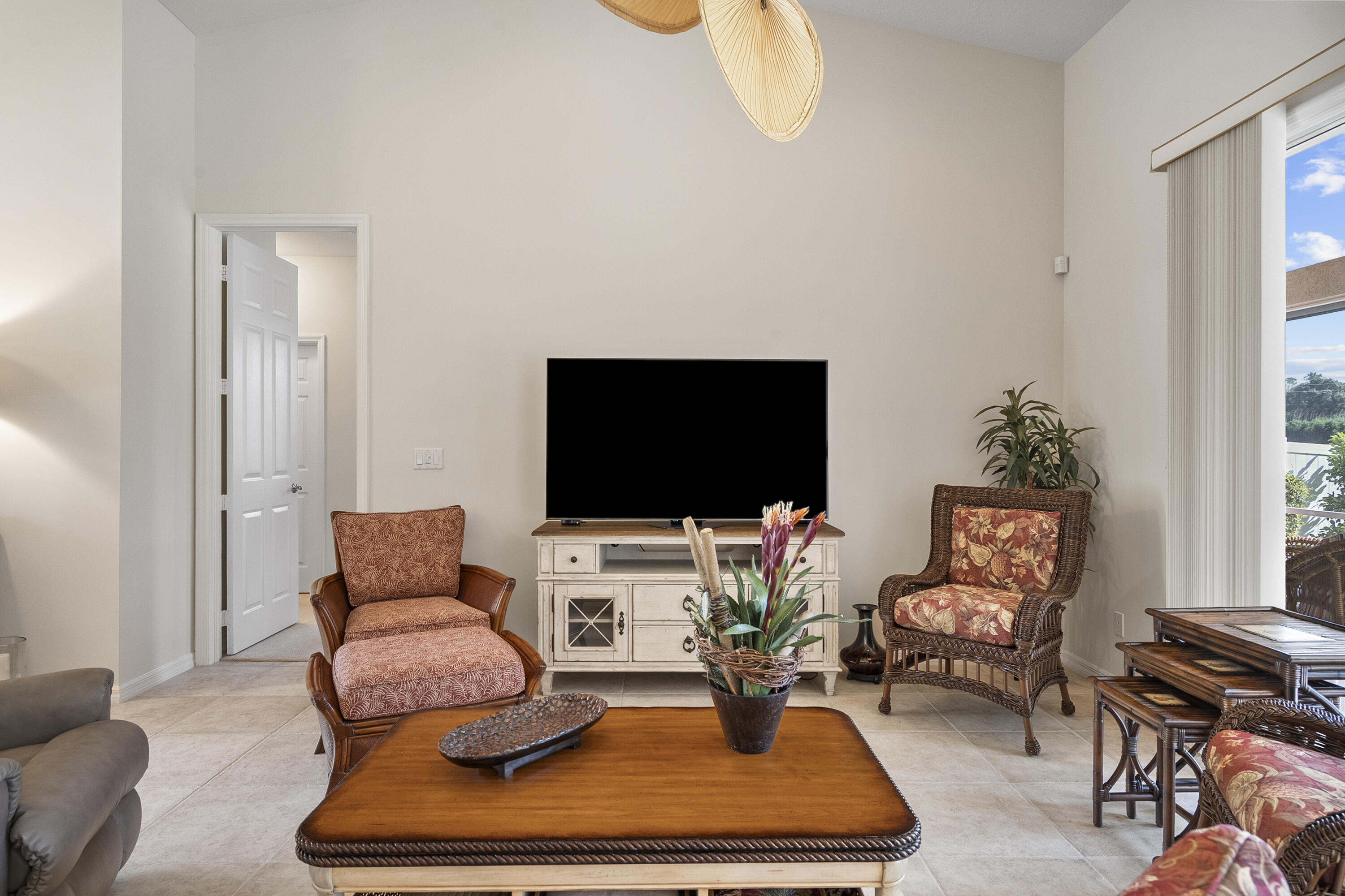 1234 Southwest Locks Road Stuart, FL 34997 - Photo 22 of 53 a living room with furniture and a flat screen tv