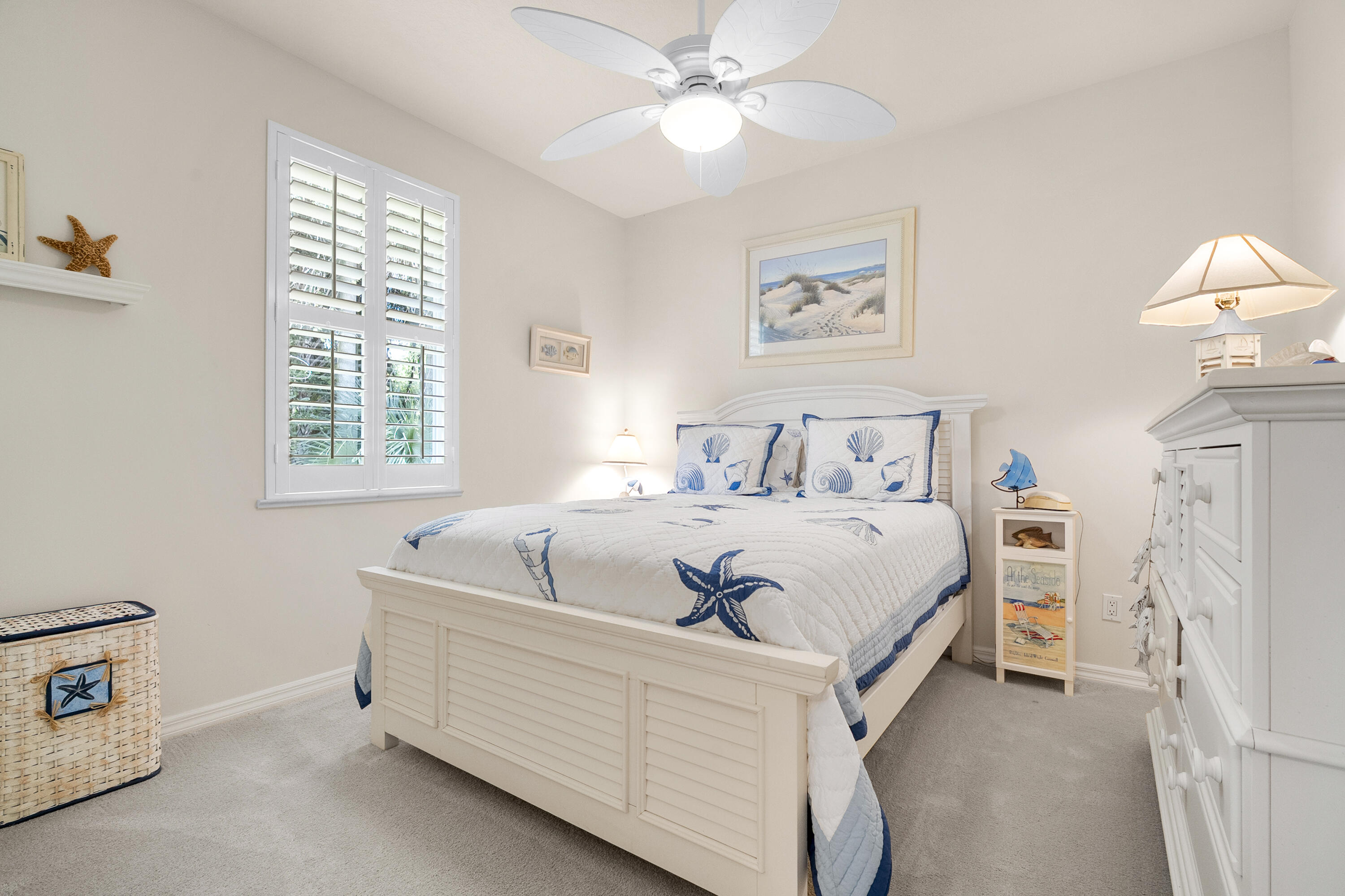1234 Southwest Locks Road Stuart, FL 34997 - Photo 23 of 53 a bed room with a bed and a chandelier