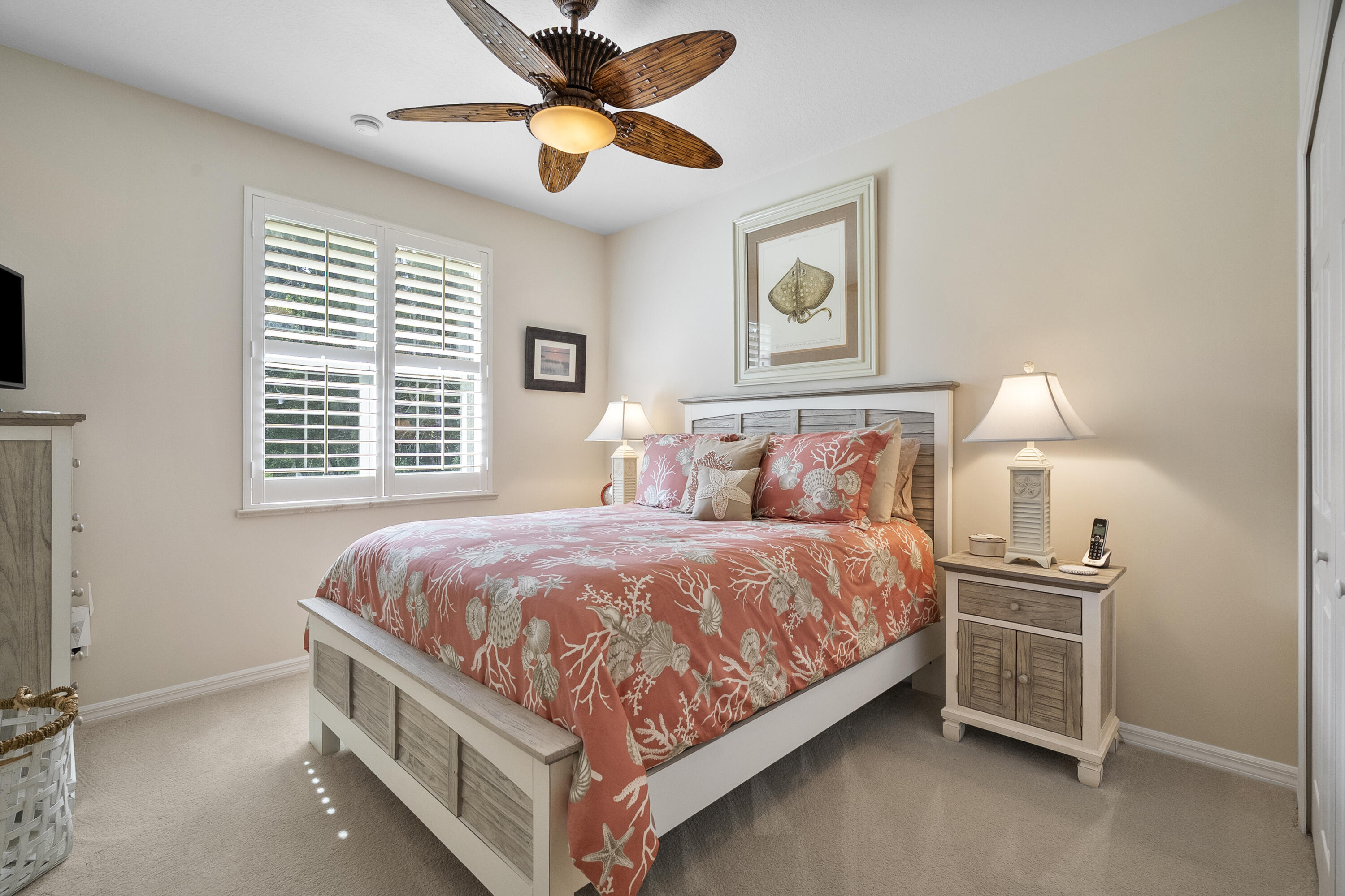 1234 Southwest Locks Road Stuart, FL 34997 - Photo 27 of 53 a bed room with a bed and a ceiling fan