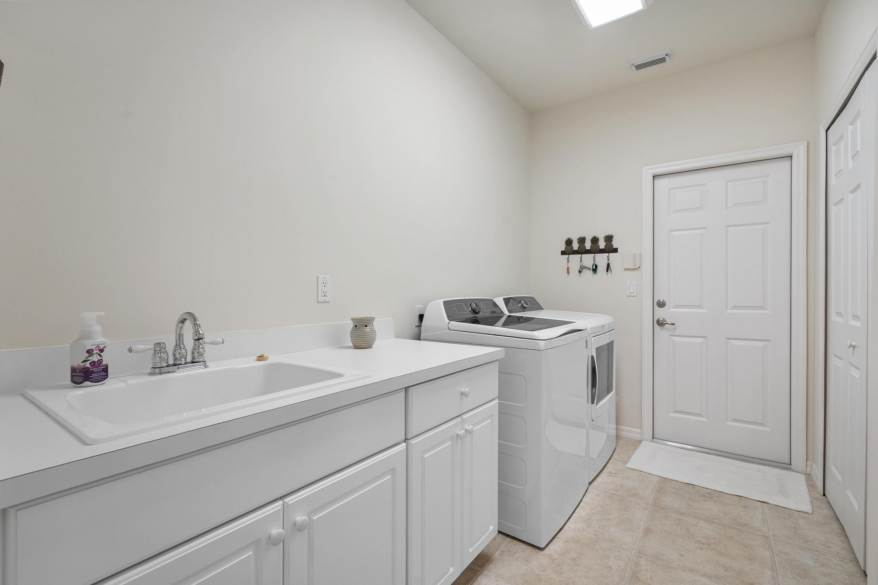 1234 Southwest Locks Road Stuart, FL 34997 - Photo 28 of 53 a utility room with dryer and washer