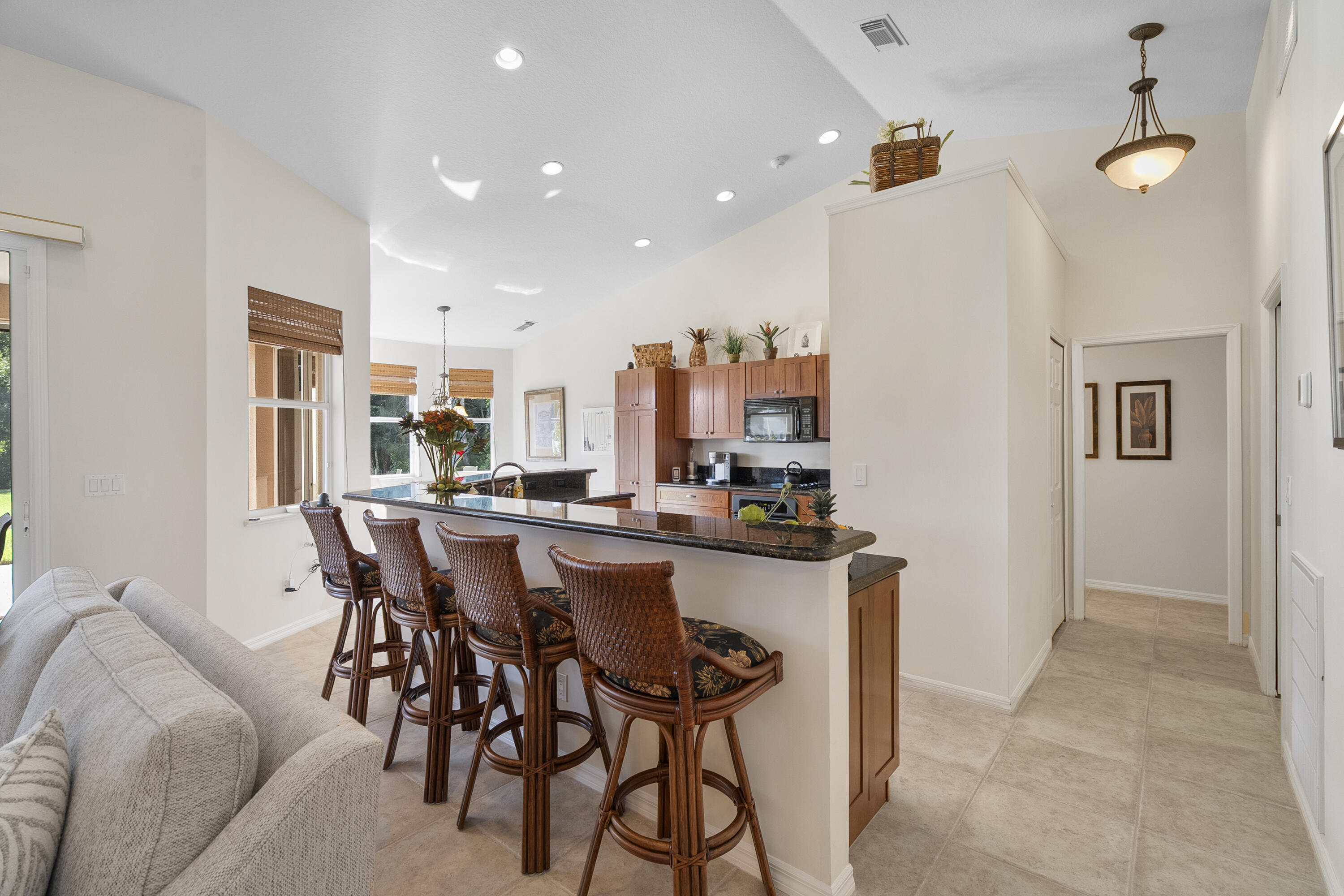 1234 Southwest Locks Road Stuart, FL 34997 - Photo 29 of 53 a dining hall with stainless steel appliances a dining table and chairs