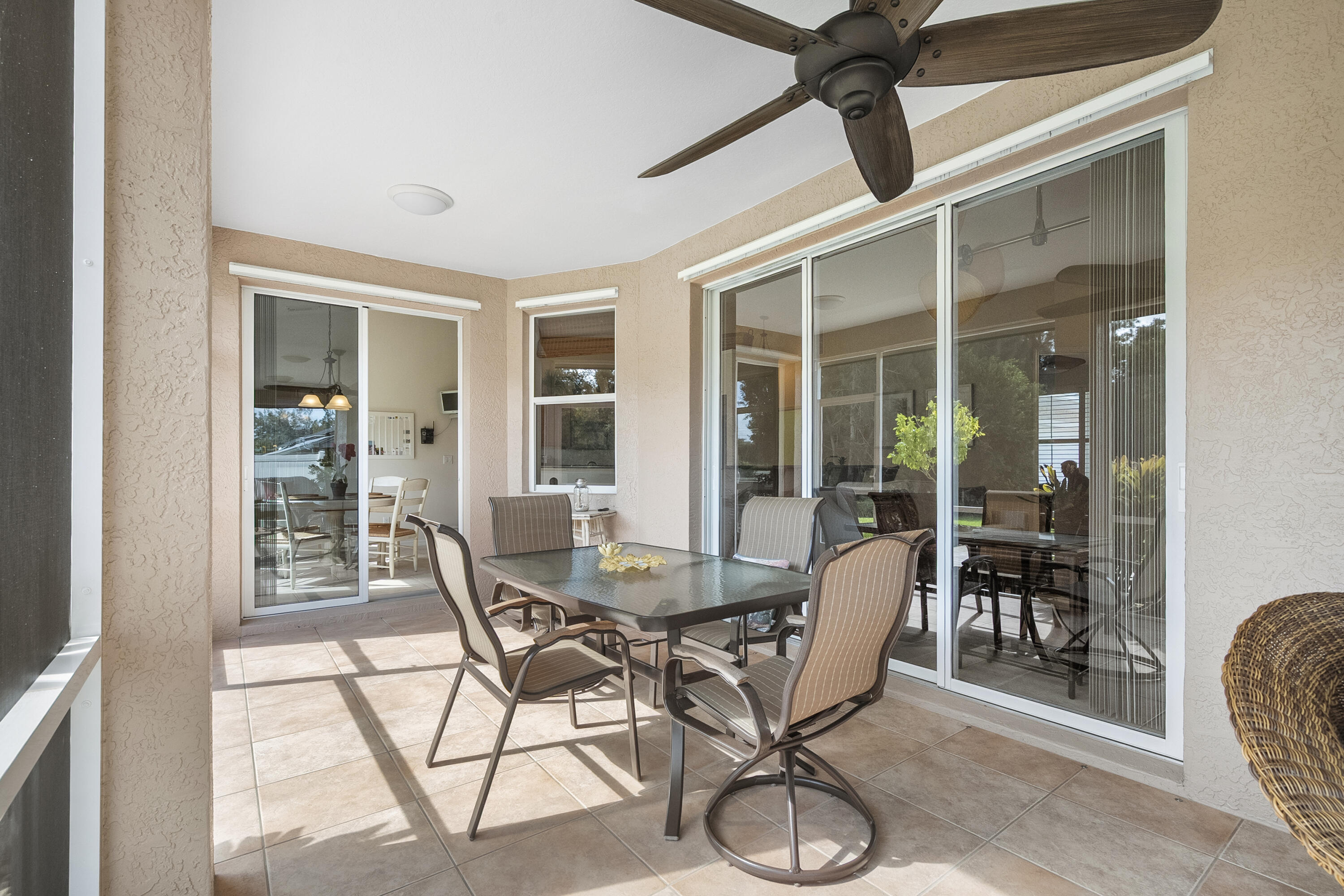 1234 Southwest Locks Road Stuart, FL 34997 - Photo 30 of 53 a dining room with furniture and wooden floor