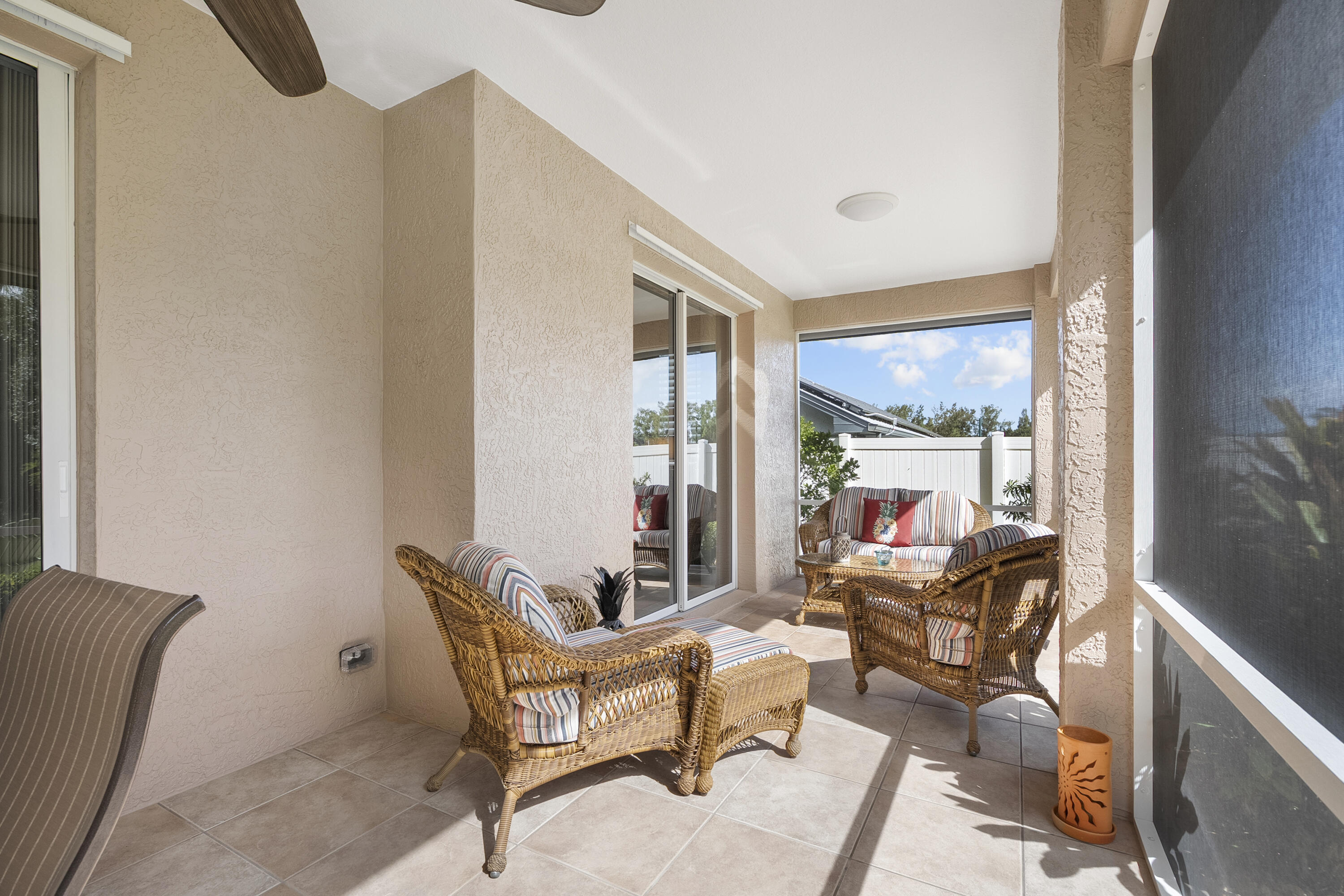 1234 Southwest Locks Road Stuart, FL 34997 - Photo 31 of 53 a living room with furniture and a floor to ceiling window