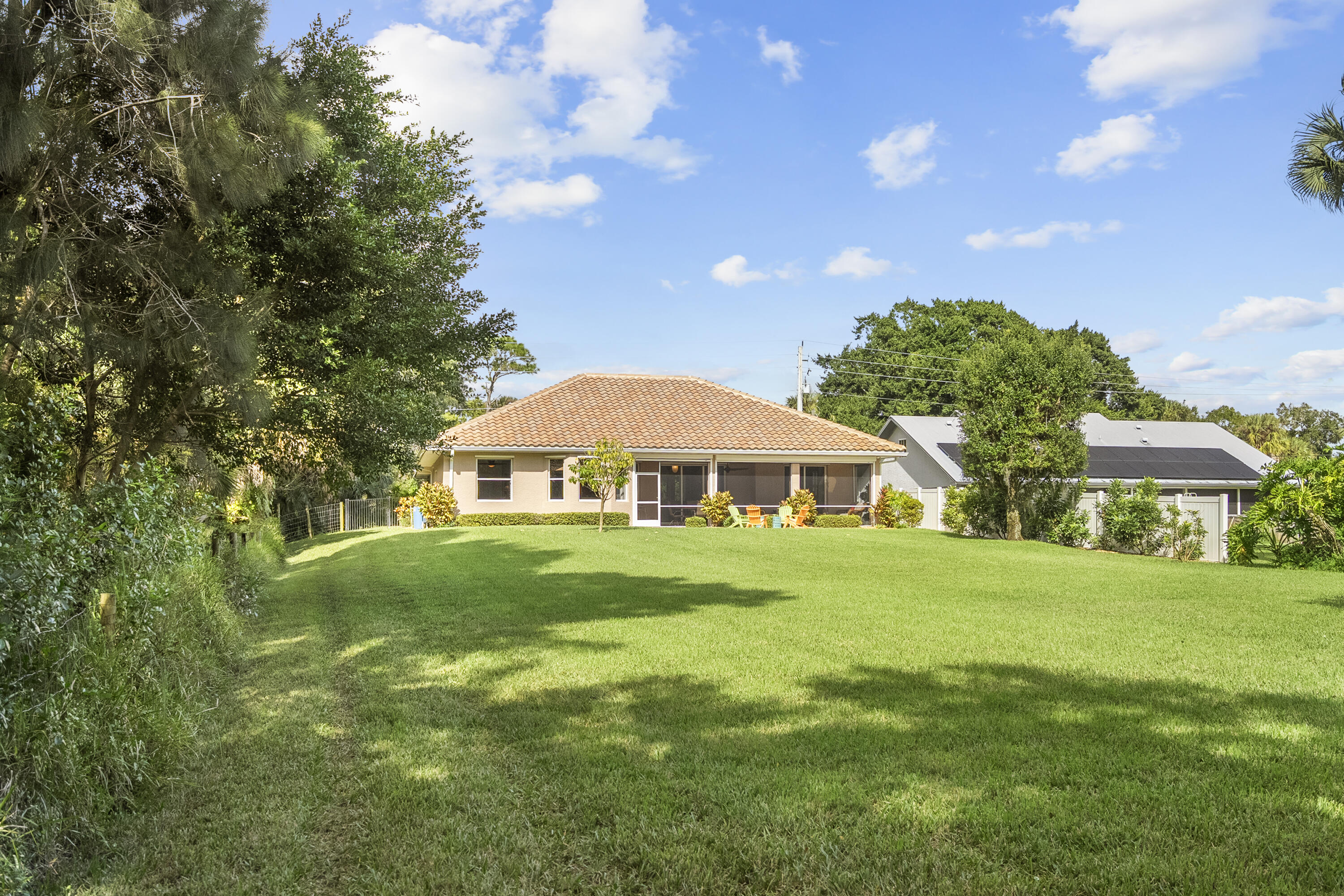 1234 Southwest Locks Road Stuart, FL 34997 - Photo 38 of 53 a view of a big yard with a house in the background