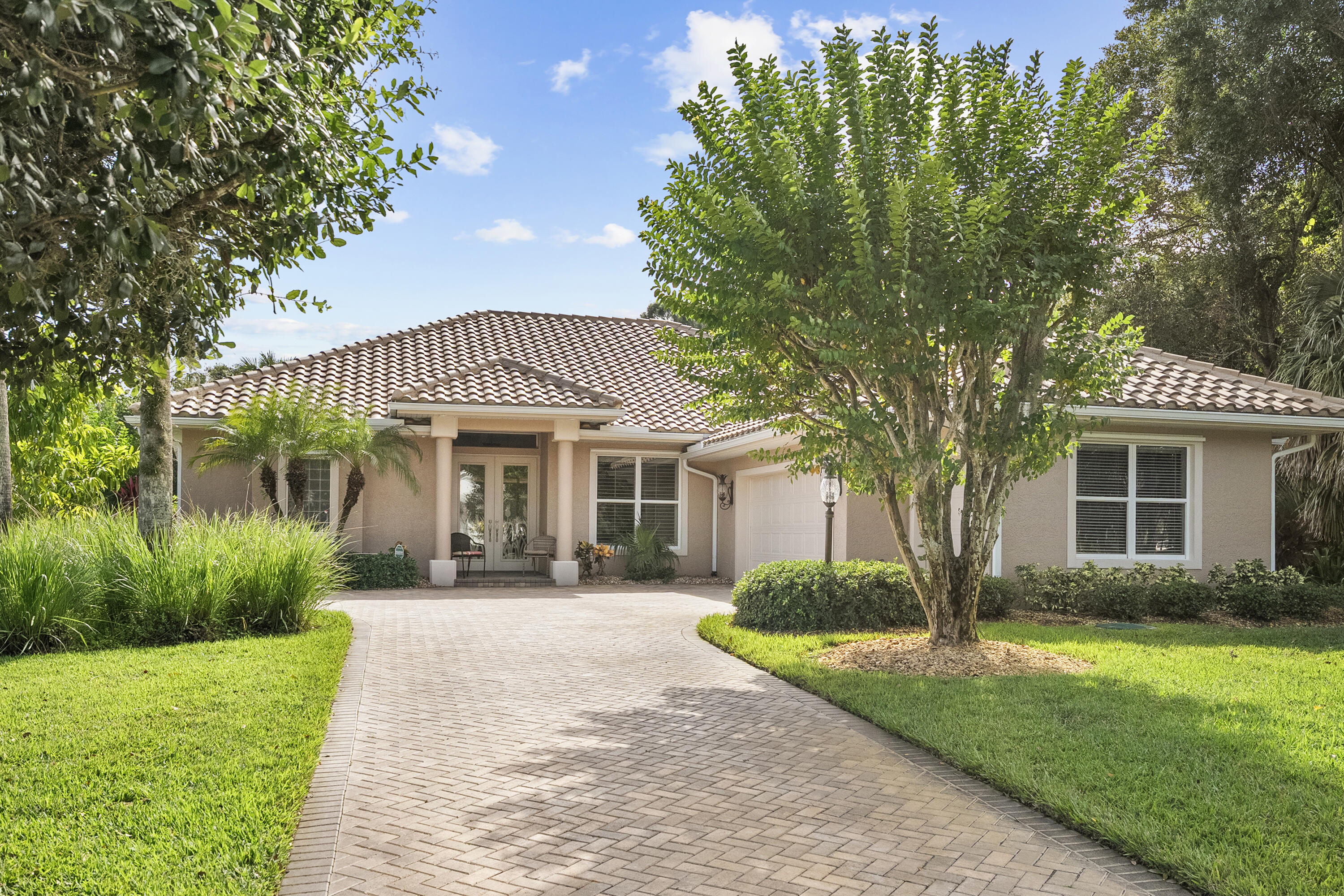 1234 Southwest Locks Road Stuart, FL 34997 - Photo 39 of 53 a front view of a house with garden