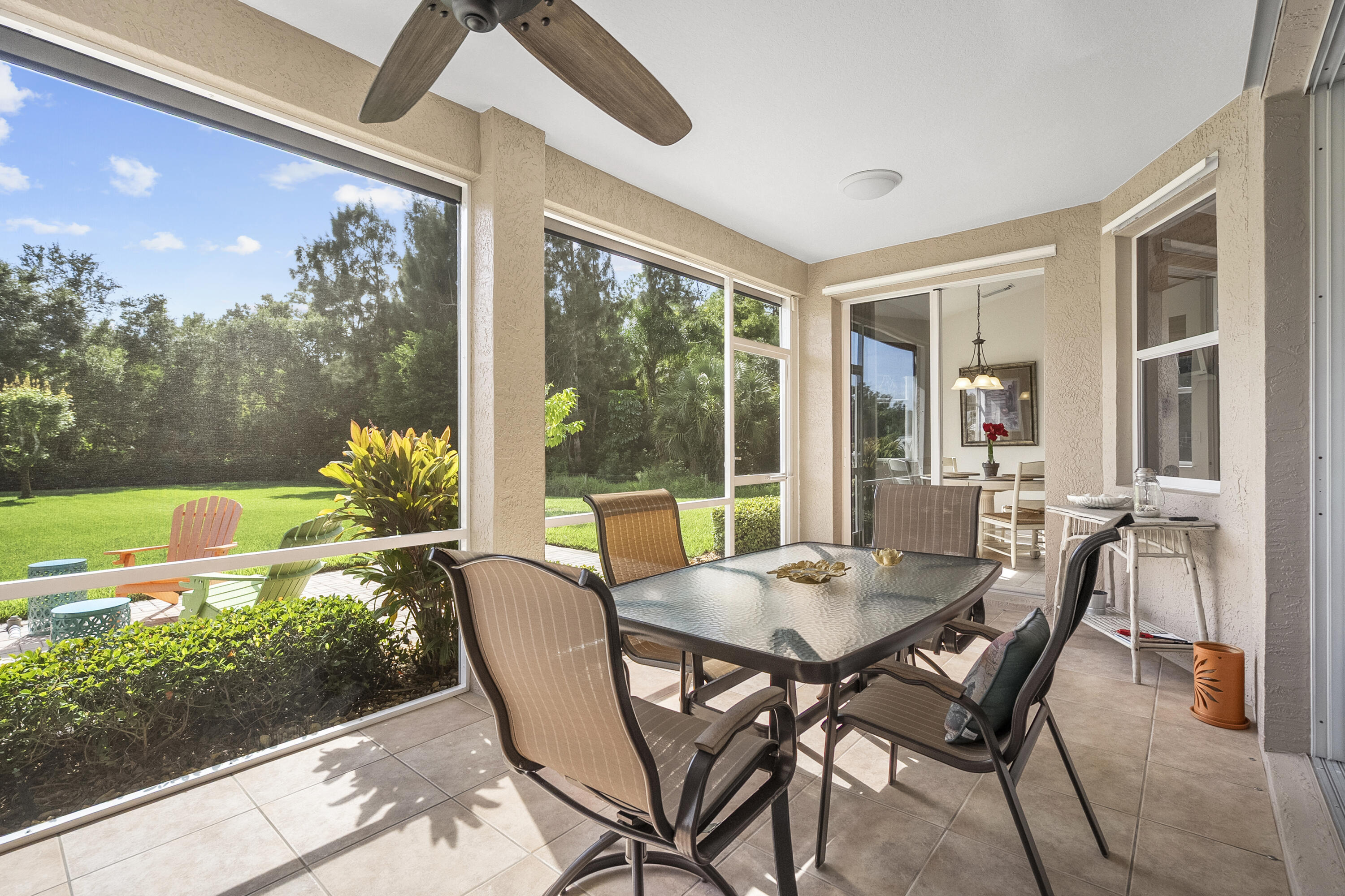 1234 Southwest Locks Road Stuart, FL 34997 - Photo 4 of 53 a view of a patio with table and chairs and potted plants