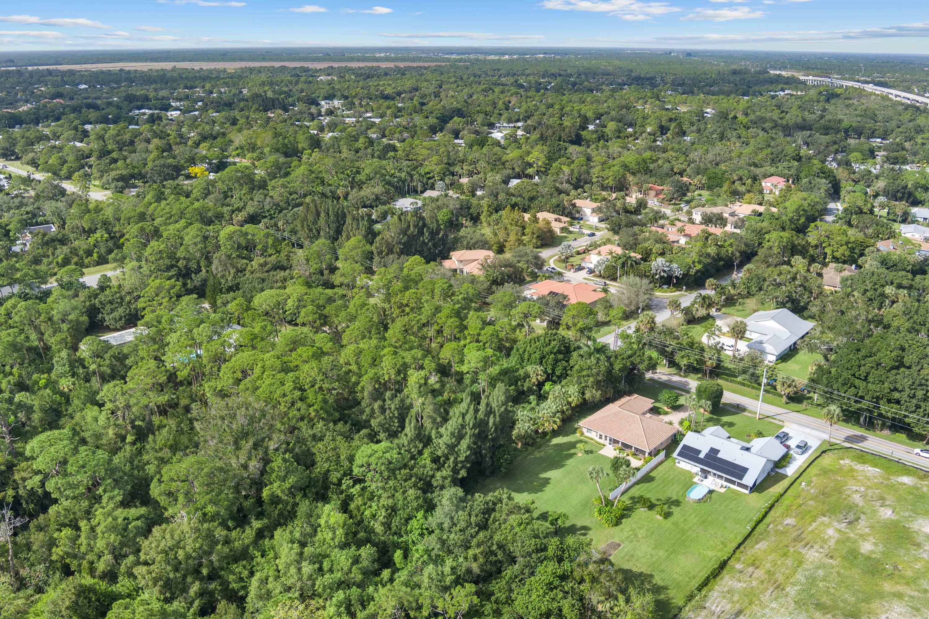 1234 Southwest Locks Road Stuart, FL 34997 - Photo 50 of 53 a view of a city with lush green forest