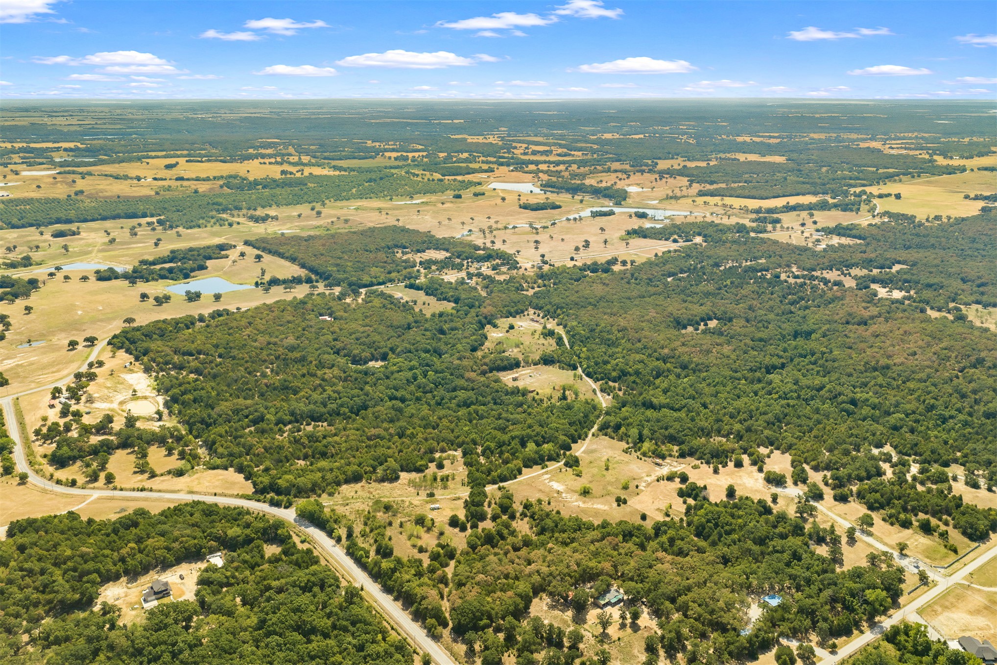 23922 Pickens Road Madill, OK 73446 - Photo 14 of 19 Expansive rural landscape featuring a mix of mature wooded areas and open fields