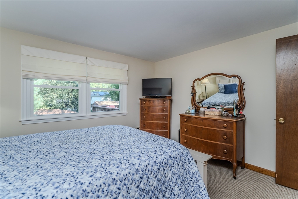 447 Ryan Road Northampton, MA 01062 - Photo 15 of 42 a bedroom with a bed and a dresser in it