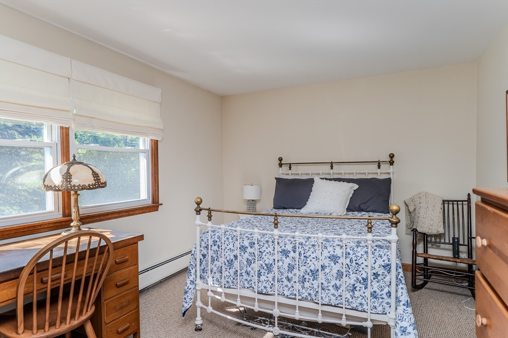 447 Ryan Road Northampton, MA 01062 - Photo 18 of 42 a bed sitting in a bedroom next to a window