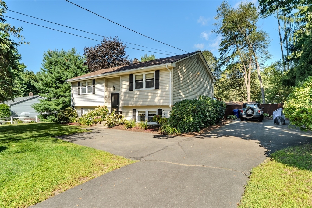 447 Ryan Road Northampton, MA 01062 - Photo 2 of 42 a front view of a house with a garden and yard