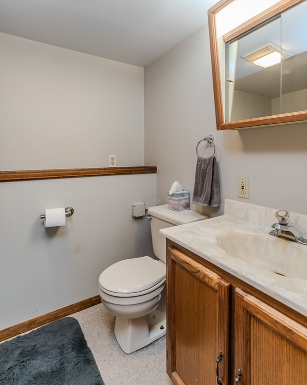 447 Ryan Road Northampton, MA 01062 - Photo 21 of 42 a bathroom with a sink a toilet and mirror