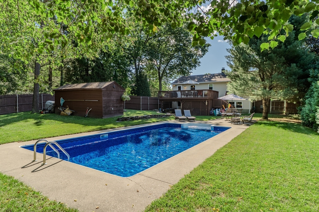 447 Ryan Road Northampton, MA 01062 - Photo 30 of 42 a view of a swimming pool with lawn chairs and plants