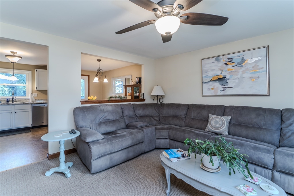 447 Ryan Road Northampton, MA 01062 - Photo 7 of 42 a living room with furniture and a chandelier