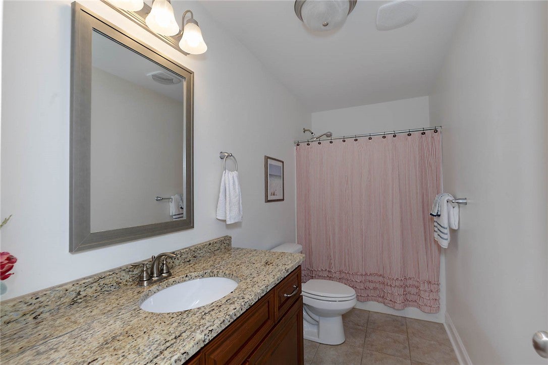 641 Deer Run Road Auburn, AL 36832 - Photo 13 of 28 This bathroom features a sleek vanity with ample counter space and a classic shower.