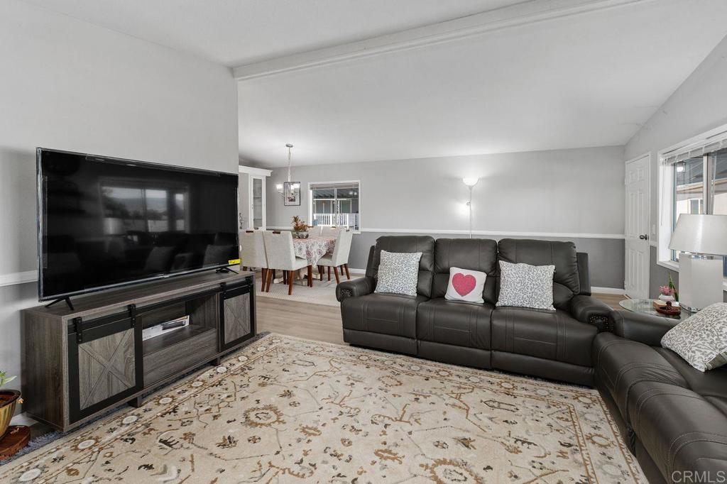 530 West Devonshire Avenue, Unit 84 Hemet, CA 92543 - Photo 3 of 36 a living room with furniture and a flat screen tv