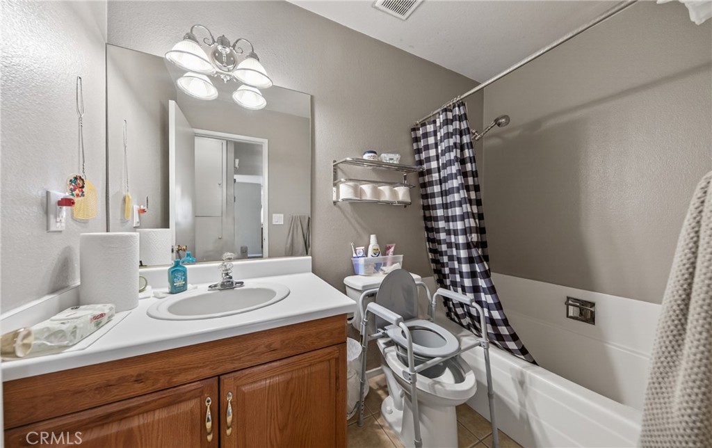 1631 Church Street Redlands, CA 92374 - Photo 11 of 11 a bathroom with a sink a toilet and a mirror