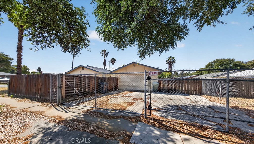 1631 Church Street Redlands, CA 92374 - Photo 4 of 11 a front view of a house with a yard covered with snow in front of house