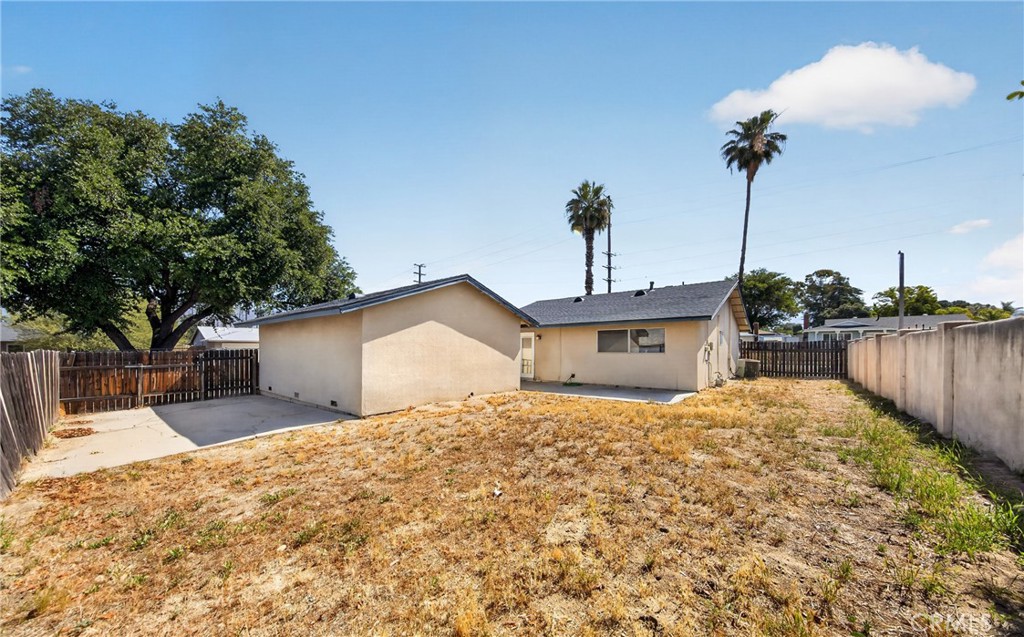 1631 Church Street Redlands, CA 92374 - Photo 5 of 11 a front view of a house with a yard and garage