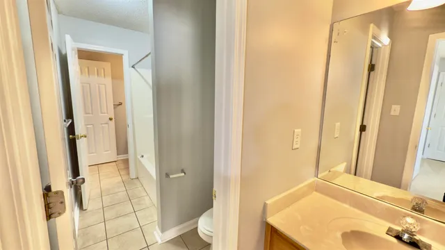 a bathroom with a tub and shower
