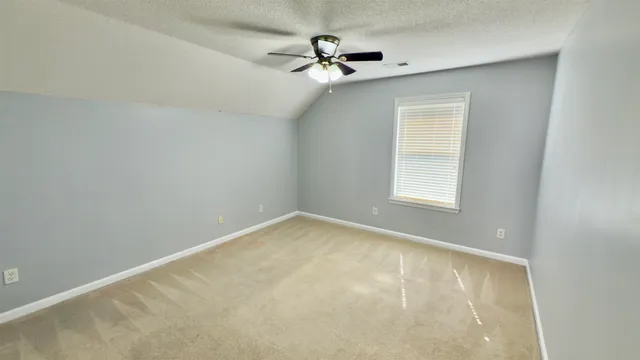 a view of a big room with carpet
