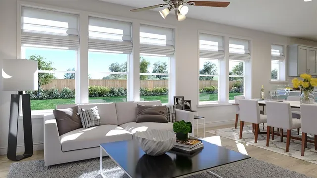 a living room with furniture and large windows
