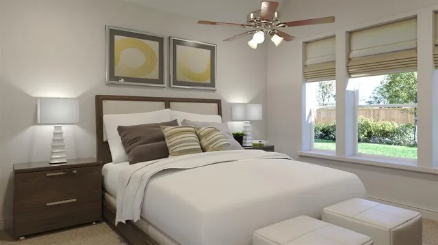 a bedroom with a large bed and a chandelier