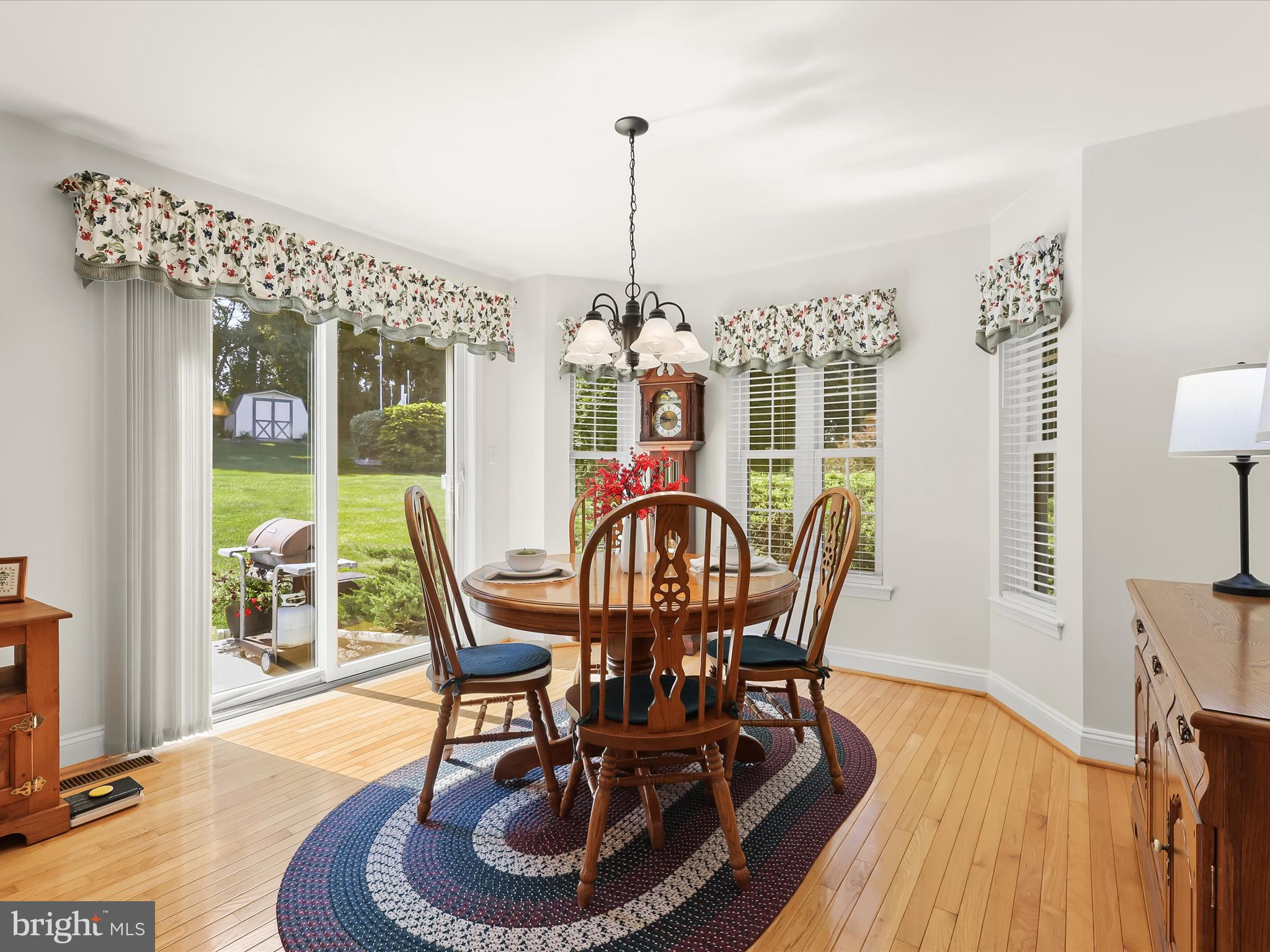 2913 Duncan Road White Hall, MD 21161 - Photo 30 of 85 a dining room with furniture a chandelier and wooden floor