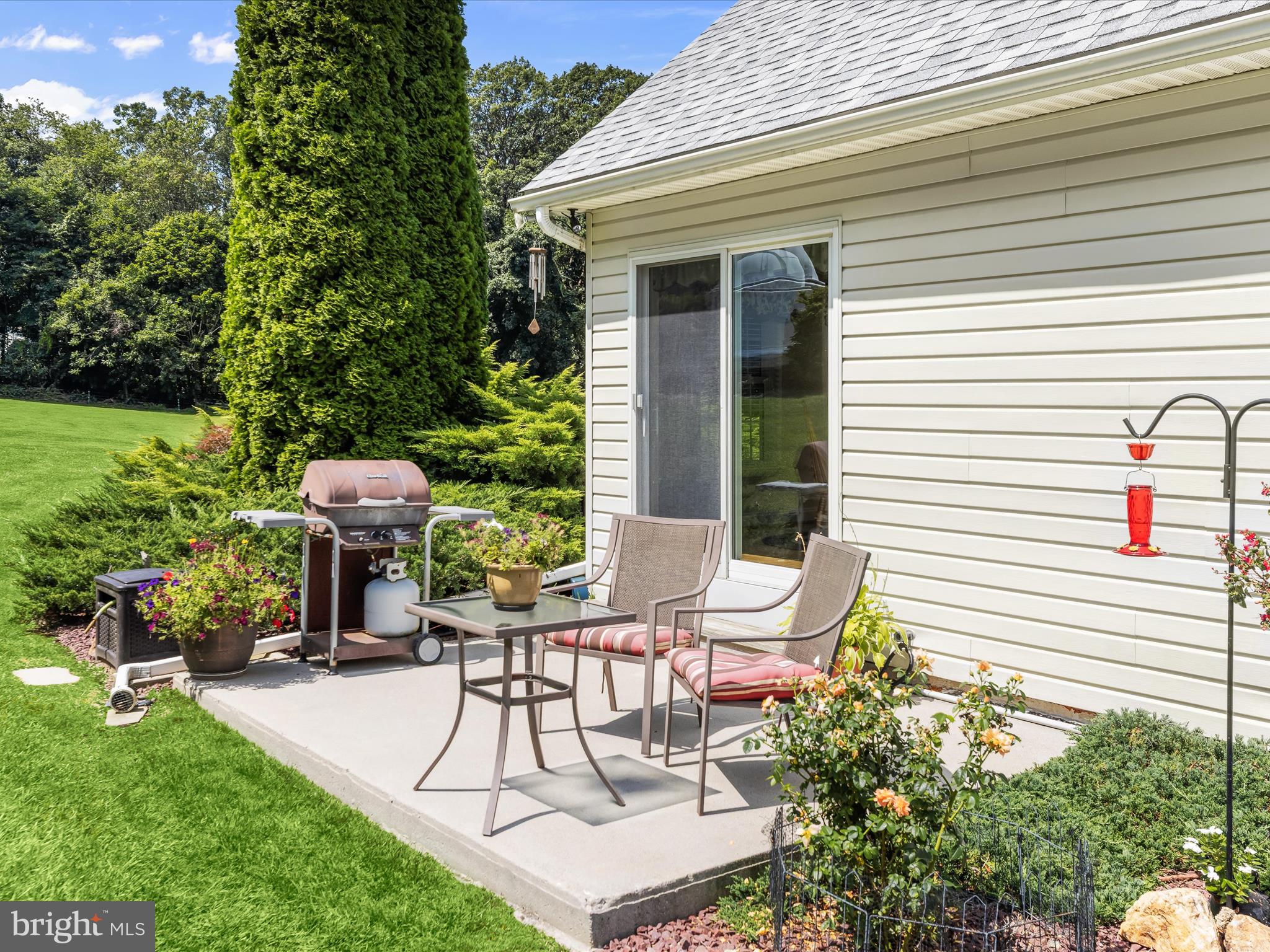 2913 Duncan Road White Hall, MD 21161 - Photo 31 of 85 a patio with table and chairs and potted plants