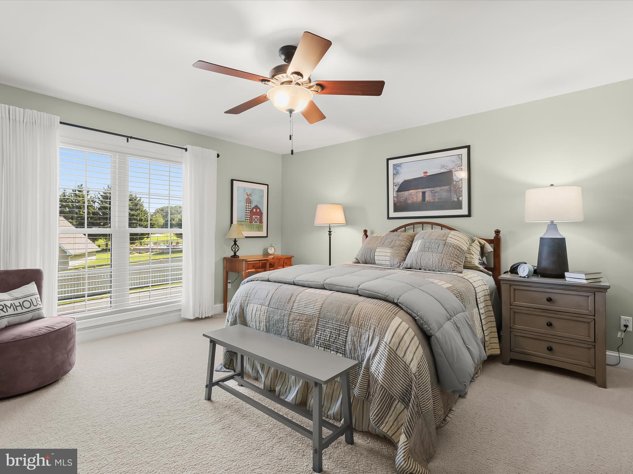 2913 Duncan Road White Hall, MD 21161 - Photo 38 of 85 a spacious bedroom with a bed a couch and a window