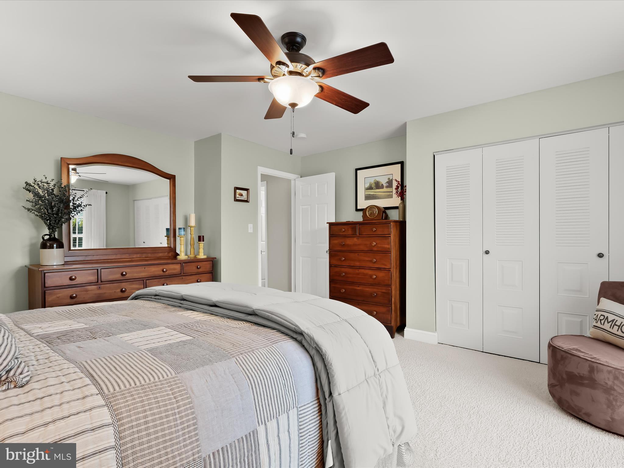 2913 Duncan Road White Hall, MD 21161 - Photo 40 of 85 a bedroom with a large bed and a chandelier