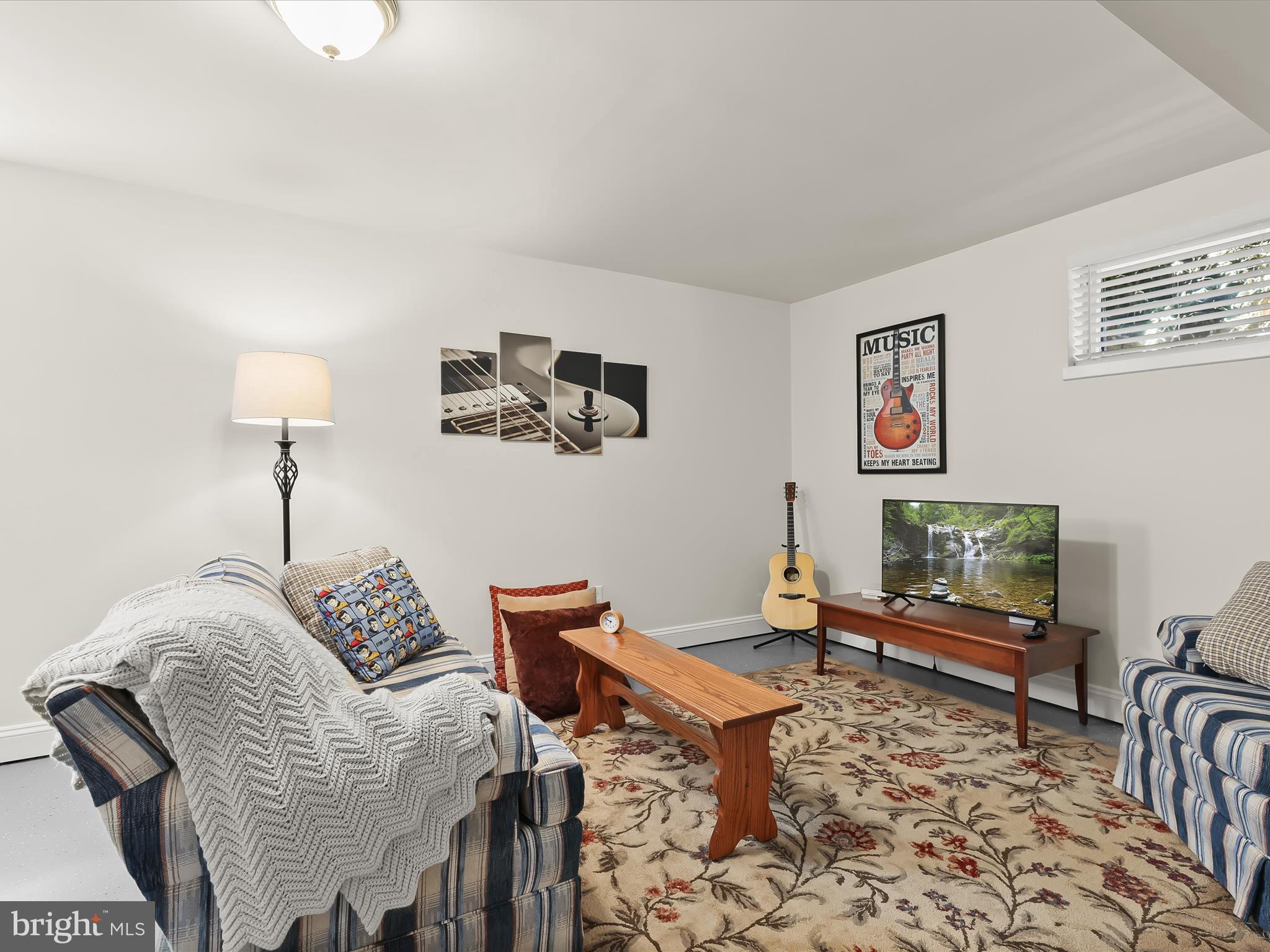 2913 Duncan Road White Hall, MD 21161 - Photo 47 of 85 a living room with furniture and a flat screen tv