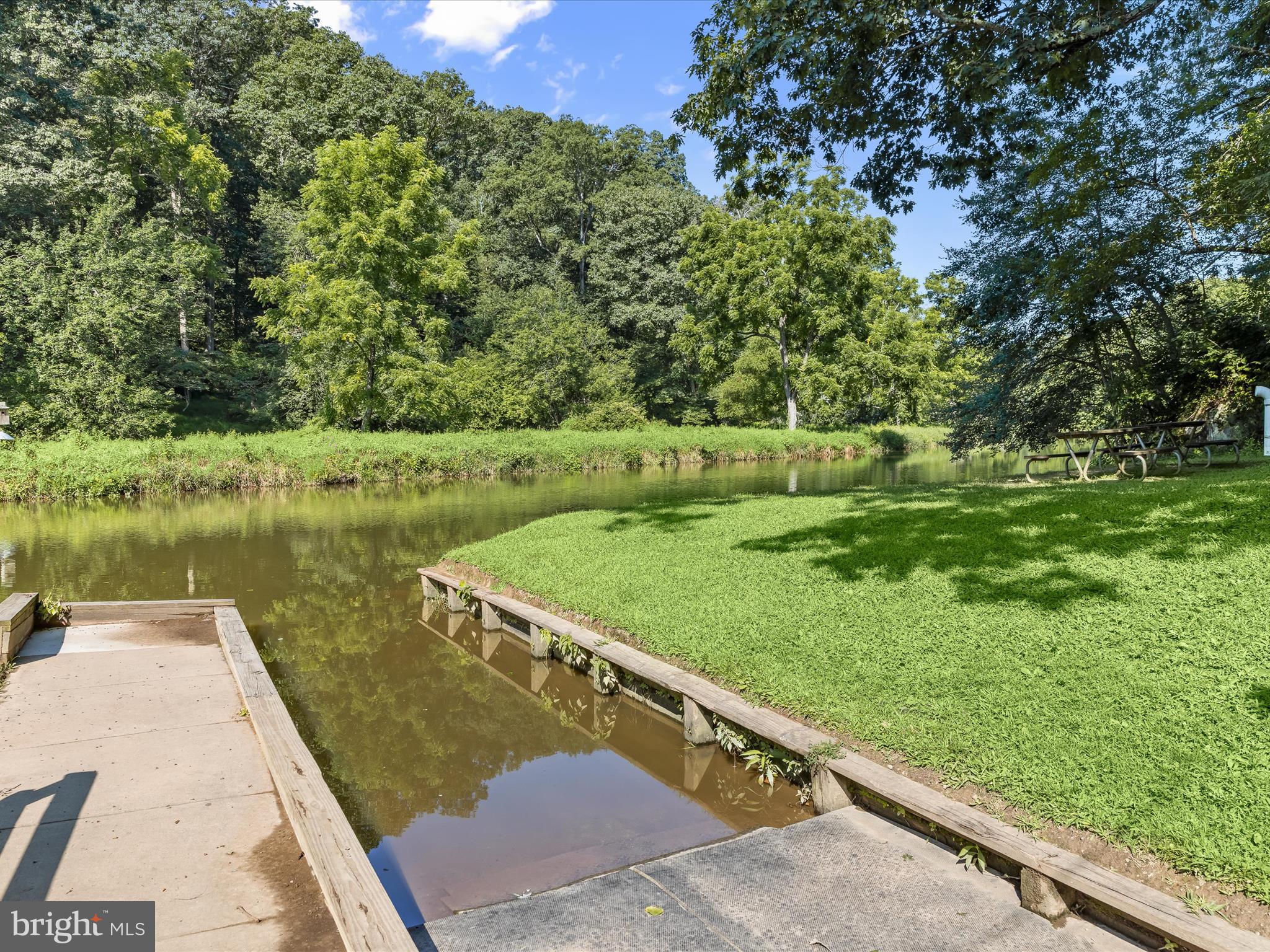 2913 Duncan Road White Hall, MD 21161 - Photo 76 of 85 a view of a lake with a yard and large trees