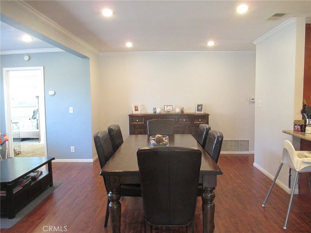 2281 Faust Avenue Long Beach, CA 90815 - Photo 19 of 41 a view of a dining room with furniture and wooden floor