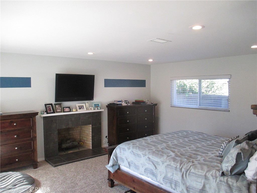 2281 Faust Avenue Long Beach, CA 90815 - Photo 23 of 41 a bedroom with a bed and a flat screen tv