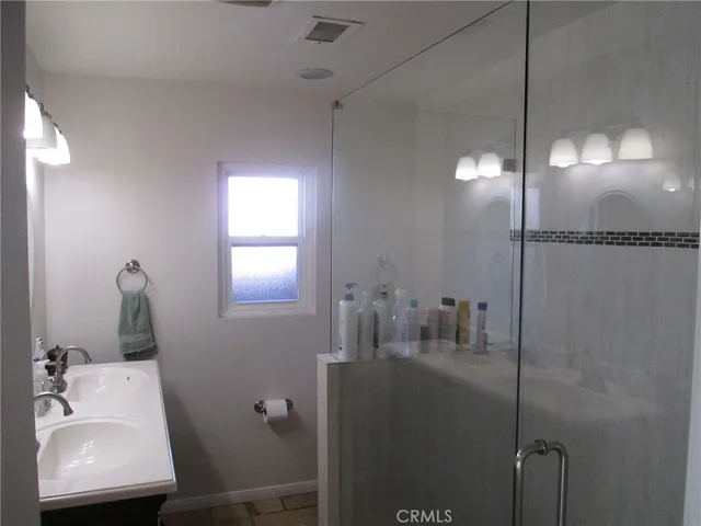 a bathroom with a sink and mirror