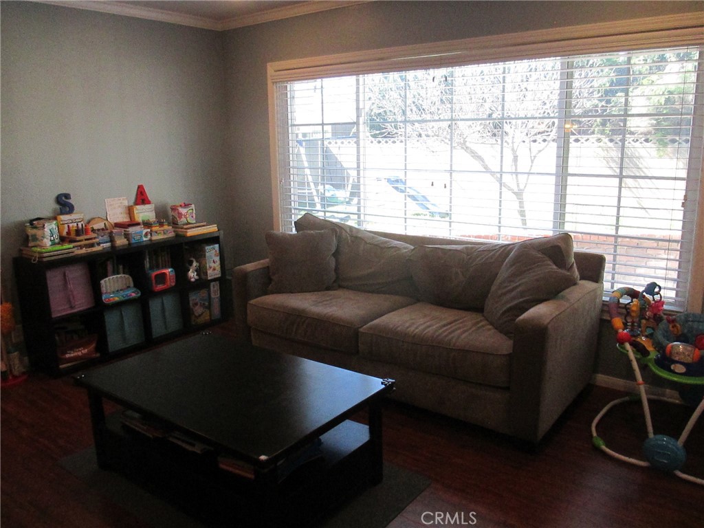2281 Faust Avenue Long Beach, CA 90815 - Photo 27 of 41 a living room with furniture and a window