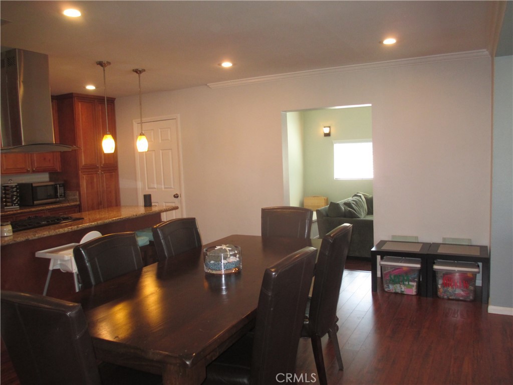 2281 Faust Avenue Long Beach, CA 90815 - Photo 29 of 41 a view of a dining room with furniture and wooden floor