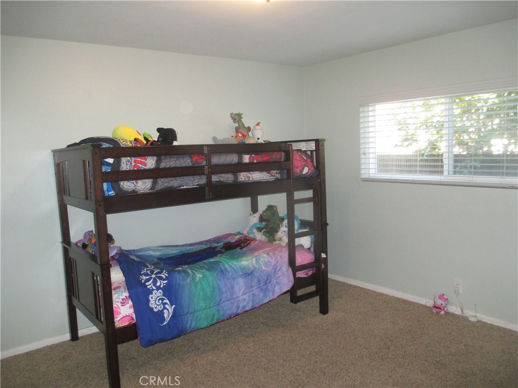 2281 Faust Avenue Long Beach, CA 90815 - Photo 33 of 41 a bedroom with a bed and a table