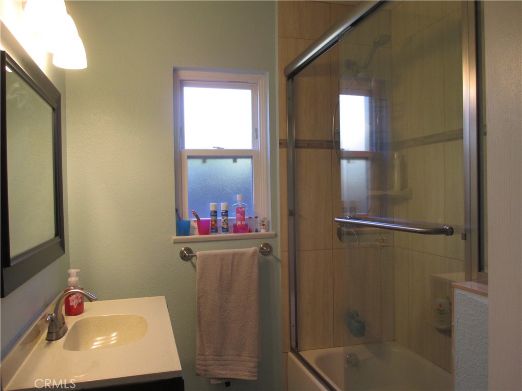 2281 Faust Avenue Long Beach, CA 90815 - Photo 36 of 41 a bathroom with a sink and a mirror