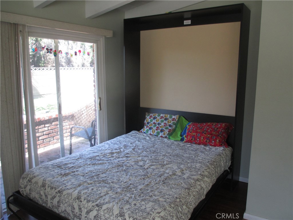 2281 Faust Avenue Long Beach, CA 90815 - Photo 41 of 41 a bedroom with a large bed and a large window