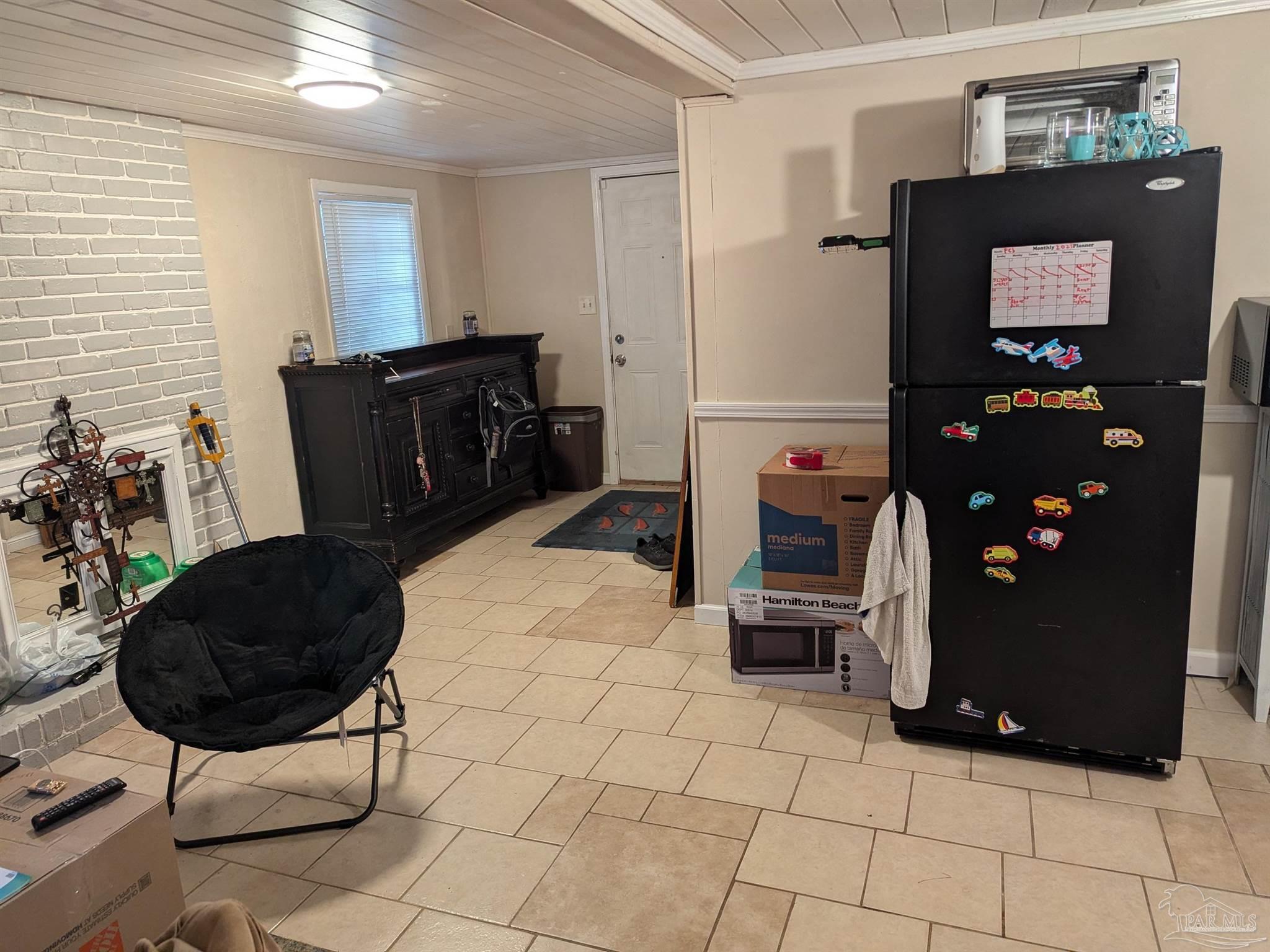 1036 Hawthorn Drive, Unit A/B Pensacola, FL 32507 - Photo 3 of 14 a living room with furniture and a flat screen tv