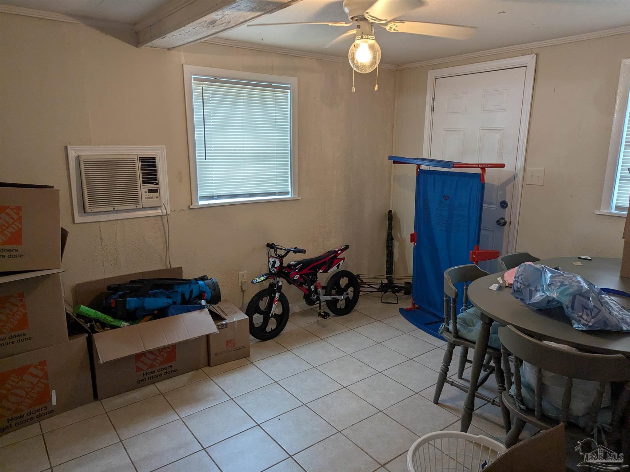 1036 Hawthorn Drive, Unit A/B Pensacola, FL 32507 - Photo 6 of 14 a living room with furniture and a mirror