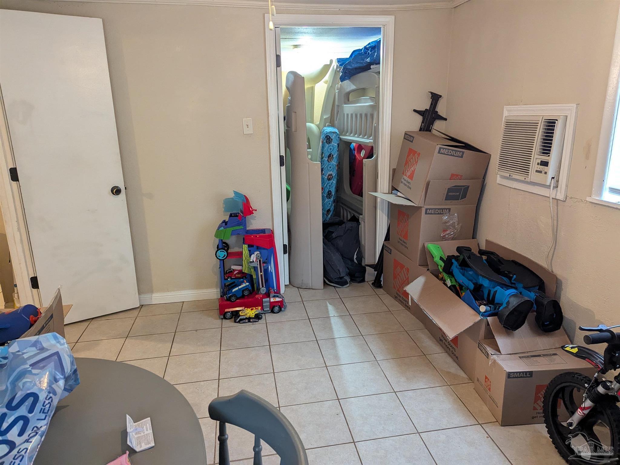 1036 Hawthorn Drive, Unit A/B Pensacola, FL 32507 - Photo 7 of 14 a room with gym equipment