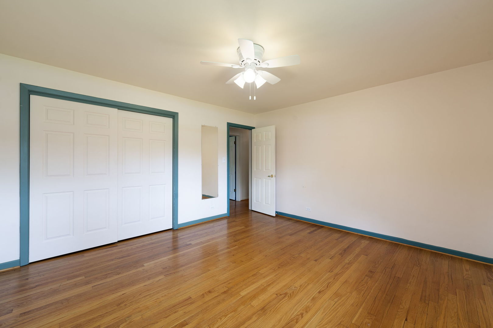 824 Braemar Road Flossmoor, IL 60422 - Photo 17 of 29 a view of an empty room with wooden floor and a window