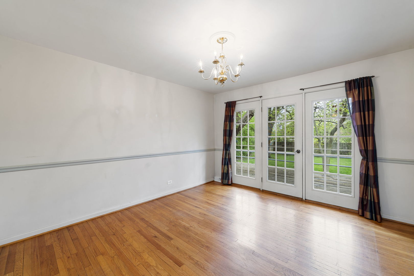 824 Braemar Road Flossmoor, IL 60422 - Photo 8 of 29 wooden floor in an empty room with a window