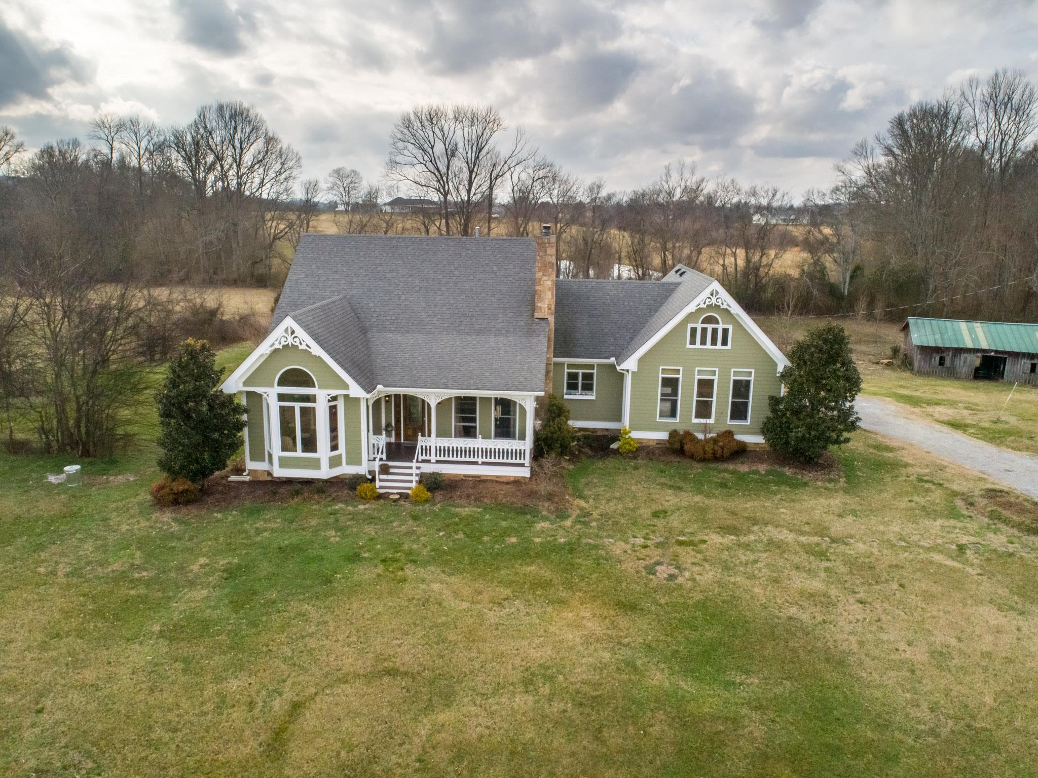 Unsurpassed character and charm.. Sitting on 8+ acres , pond, shop, barn, custom features throughout home..