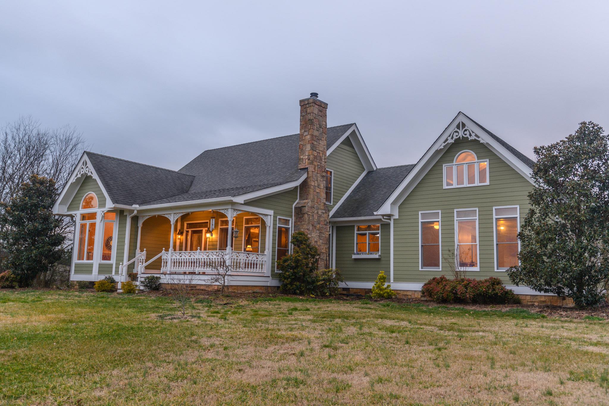 Charming home with curb appeal, wood burning stove, cathedral ceilings in kitchen and much more